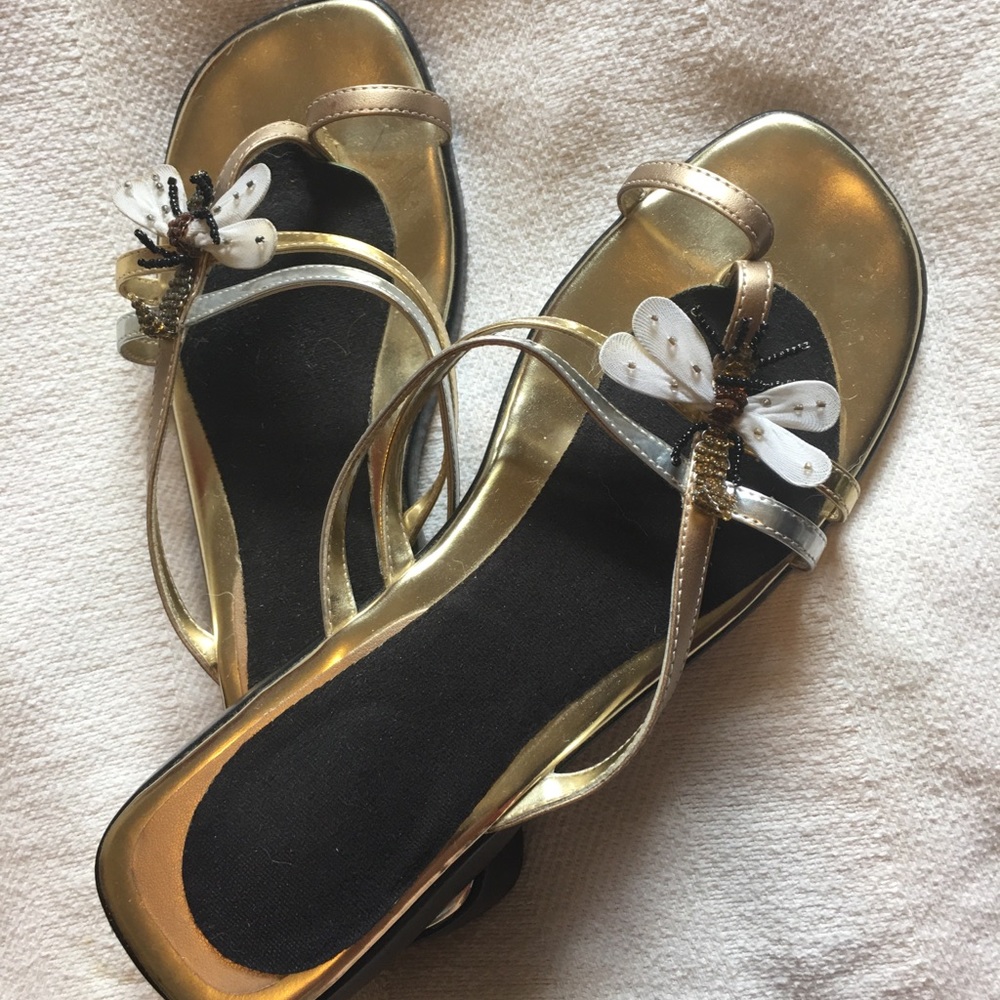 Cute summer sandals with dragonfly on top.